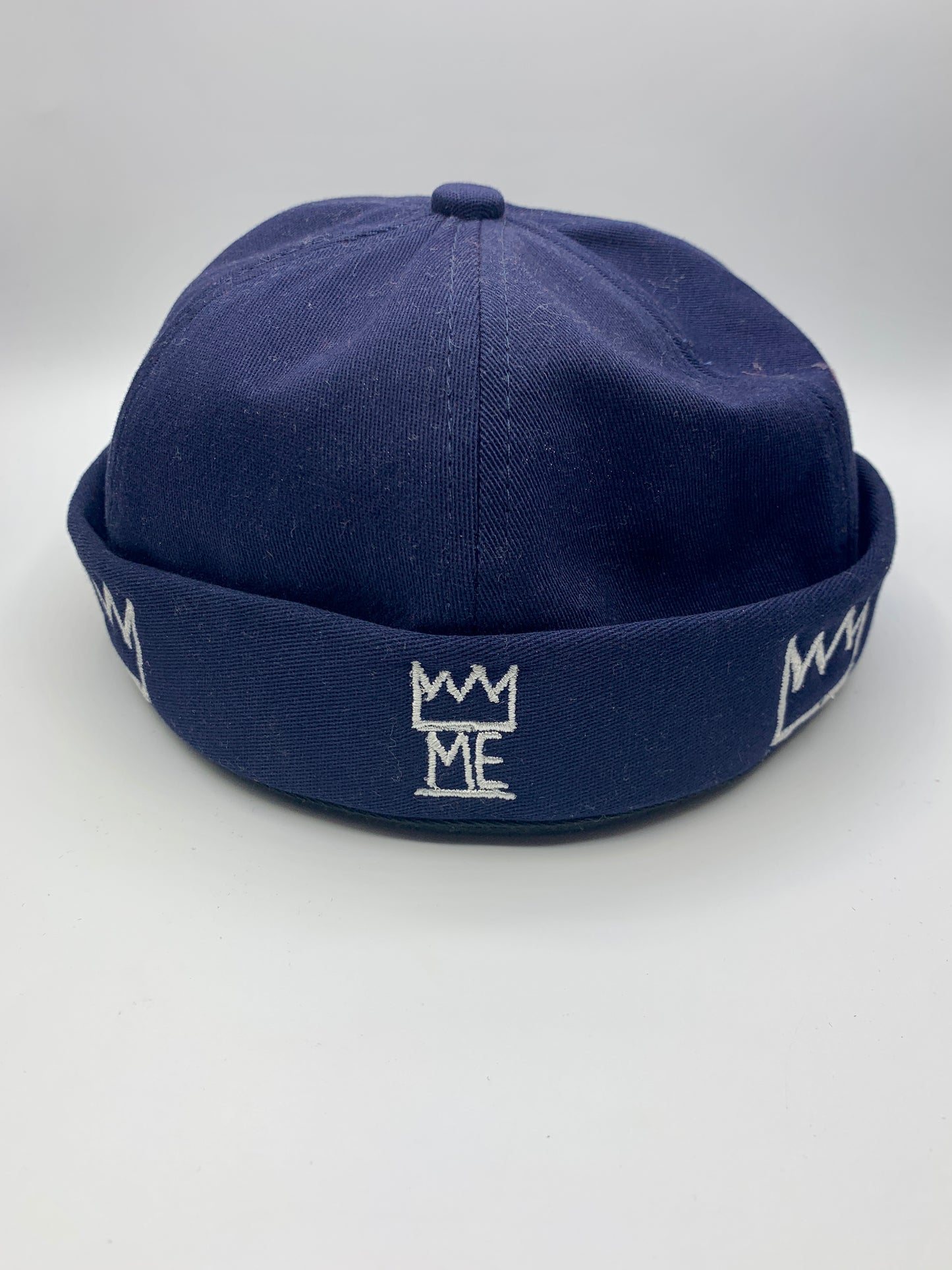 Blue Brimless Hat with White Krown