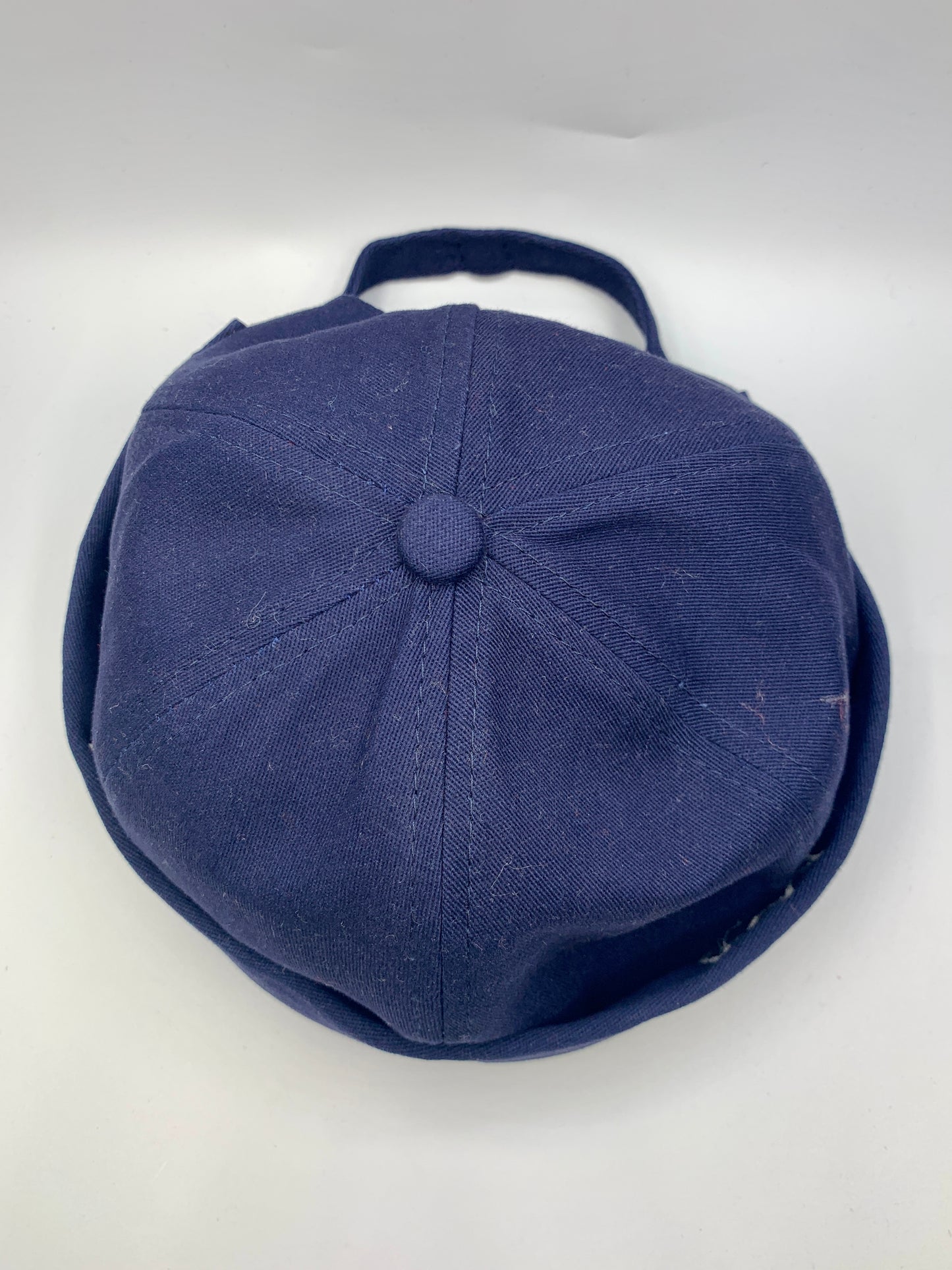 Blue Brimless Hat with White Krown