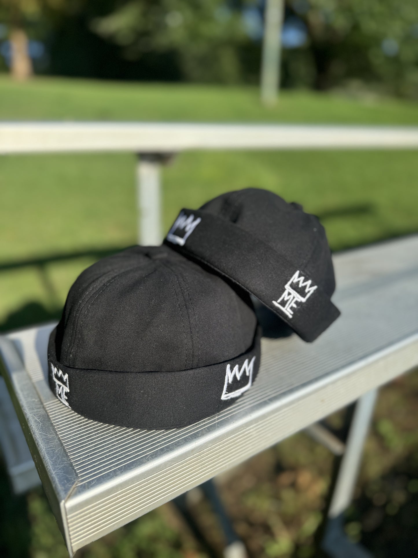 Black Brimless Hat with White Krown